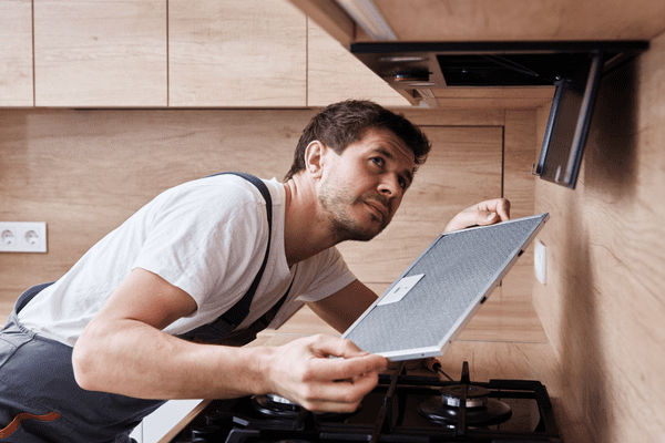 Person fixing rangehood